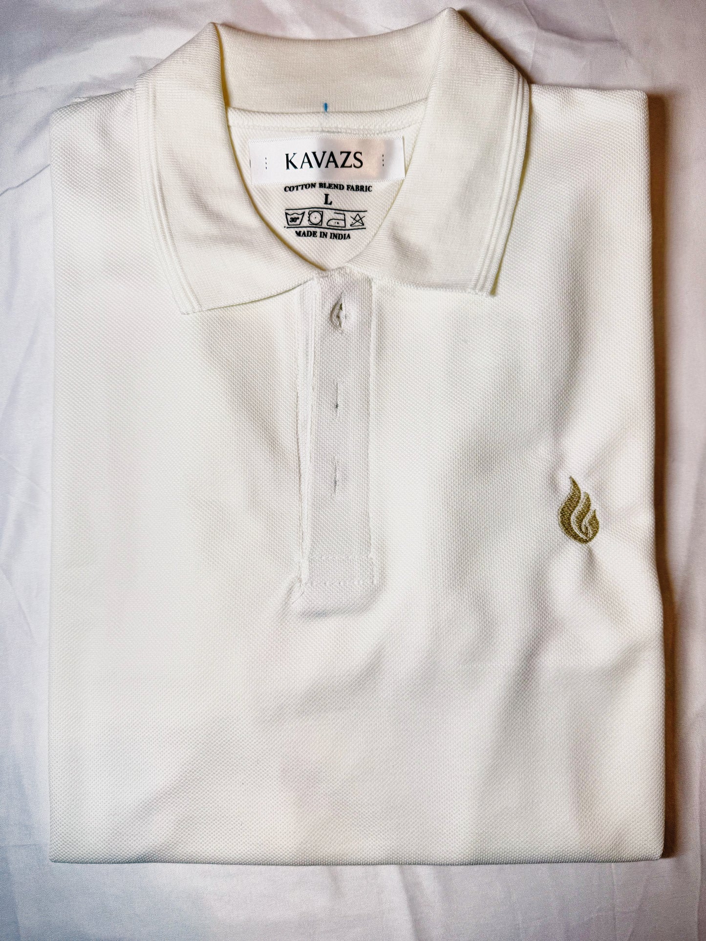 White polo shirt with a small Kavazs logo on a light background